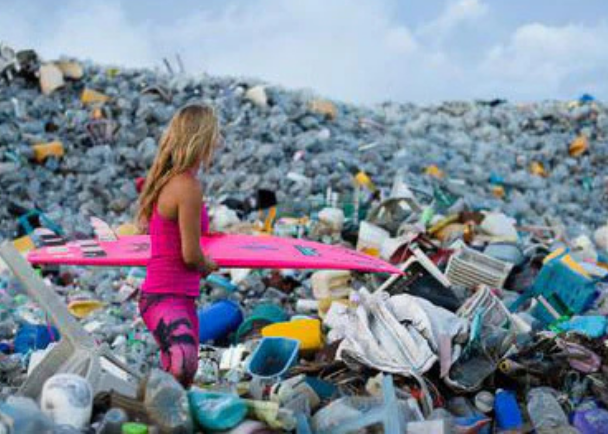 a surfer wearing all pink looks out over a landscape of plastic waste