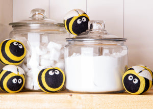 5 dryer balls with a cute black and yellow pattern